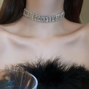 Close-up of sparkling multi-row rhinestone choker necklace on model for evening party