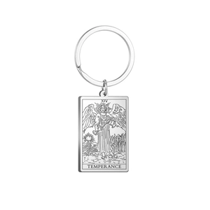 Macro shot of silver stainless steel rectangular Temperance tarot card keychain charm