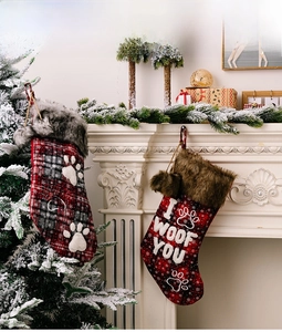 Detail of red and black plaid Christmas pet stockings with faux fur and I WOOF YOU embroidery
