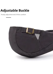 Detail of adjustable metal buckle on dark grey washed cotton flat cap for custom fit