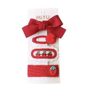 Red festive hair clips set with fabric bows and knitted flower designs for girls