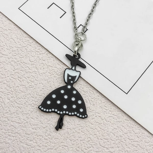 Chic silver necklace with black and white polka dot dress lady pendant in soft lighting