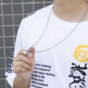 Men's silver stainless steel box chain necklace with textured spinning ring pendant