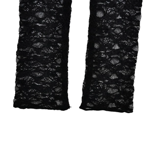 Close-up of black floral lace fabric with intricate mesh patterns and sheer texture