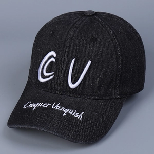 Detail of white CV 3D embroidery on black denim baseball cap with vintage finish