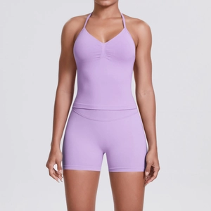 Close-up of seamless purple yoga set featuring a V-neck halter top and high-waist shorts