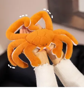 Soft plush king crab toy being held to show its realistic texture and large size