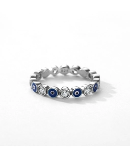 Macro shot of 925 silver ring featuring blue evil eye enamel and white zircon stones