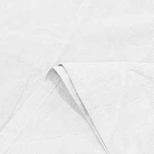 Close-up of white linen polo shirt texture with detailed double-stitched hem and seams