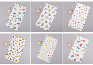 Detail of six high-density cotton baby gauze towels with various cartoon animal prints