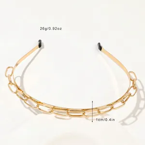 Close-up of golden double chain headband with black protective rubber tips and polished finish