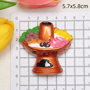 Close-up of a realistic resin hot pot fridge magnet miniature measuring 5.7x5.8cm