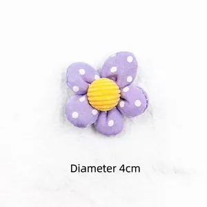 Detail of 4cm purple polka dot fabric flower with yellow center for DIY hair accessories