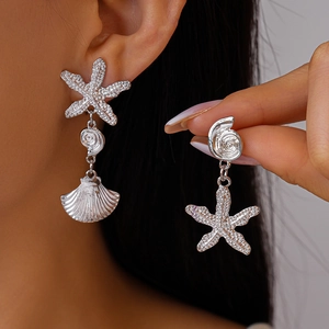 Chic silver starfish and shell asymmetric drop earrings for women with metallic texture