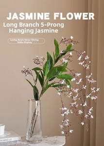 Detailed view of artificial hanging jasmine with 5-fork white blossoms in a glass vase