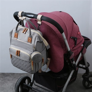 Gray multifunctional diaper backpack with stroller hooks and accessory pouch on handle