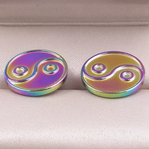 Macro shot of 304 stainless steel tai chi stud earrings with rainbow iridescent plating