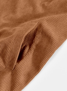 Detailed close-up showing the brown corduroy fabric texture and pocket stitching of the jacket