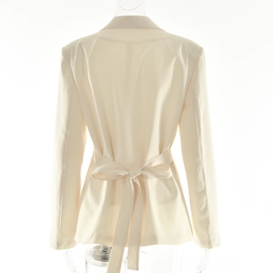 Back view of light beige blazer featuring a stylish waist tie bow for a slim fit look