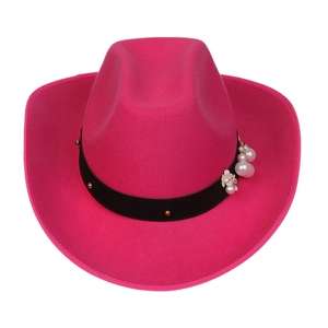 Detailed close-up of pink wool felt cowboy hat with pearl and floral band accents