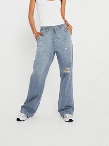 Jeans larghi azzurri da donna con vita elastica a coulisse e strappi sulle ginocchia alla moda