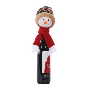 Detail of Christmas snowman wine bottle set featuring a knit hat and red tassel scarf