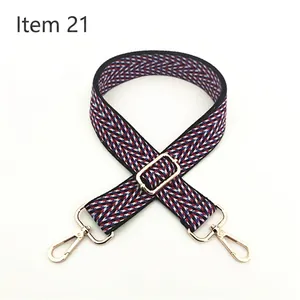 Close-up of red and blue chevron pattern cotton strap with gold metal lobster clasps