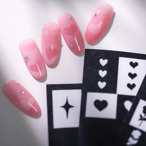 Pink gradient press-on nails set with heart rhinestones and airbrush hollow stencils