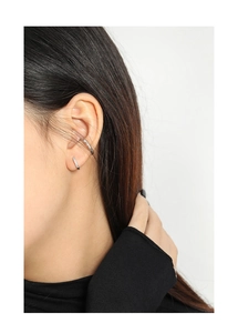 Close-up of minimalist S925 sterling silver ear cuffs with micro-pave cubic zirconia