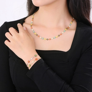 Sweet titanium steel jewelry set featuring colorful daisy necklaces and cross bracelets