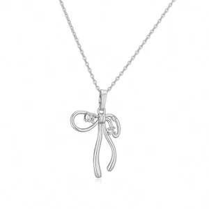 Detailed view of silver bow necklace with pearl tassel and crystal-encrusted ribbon pendant