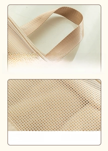 Detail of the widened nylon handle and breathable mesh fabric on travel storage bag