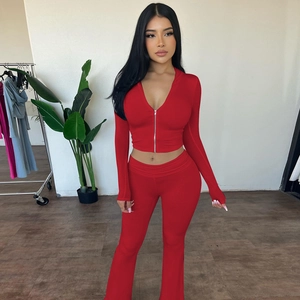 Detail of red zip-up cropped hoodie and flare pants two-piece set for women