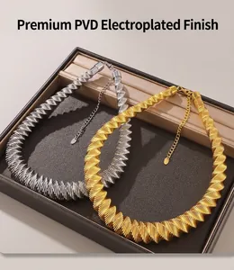 Detail of silver and gold geometric spring necklaces with PVD electroplated finish