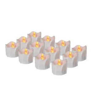 Set of 12 LED tea lights with warm yellow flickering flame and melting wax design