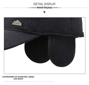 Detail of fleece-lined winter baseball cap with earflaps and textured navy fabric