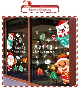 Detailed view of Christmas window decals featuring Santa, reindeer, and festive snowflakes
