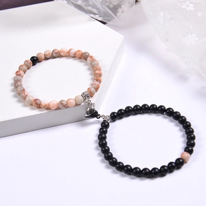 Matching pink zebra stone and matte black bead bracelets with heart magnetic clasp