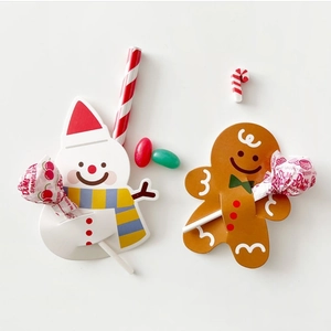 Christmas snowman and gingerbread man lollipop paper decorative cards on white background