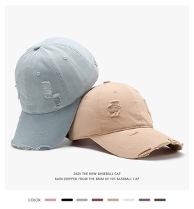 Detailed macro view showing distressed torn brims and vintage washed cotton textures of baseball caps