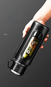 Inverted view showing the leak-proof silicone seal of the black double-wall glass bottle