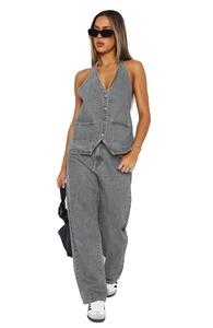 Detailed view of grey denim vest set featuring halter neckline and high-waist trousers