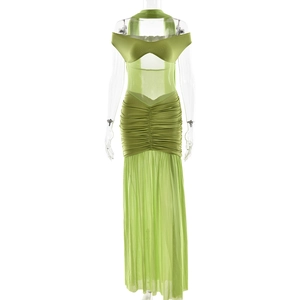 Detail of green strapless ruched mesh dress featuring an elegant side slit design