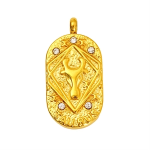 Vintage 18K gold plated Taurus zodiac pendant with white zircons on a hammered metal plate
