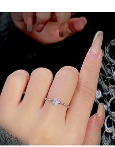 Macro shot of S925 sterling silver bamboo knot ring with sparkling round diamond center