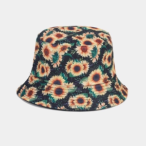 Detailed close-up of vibrant sunflower print on cotton canvas bucket hat fabric