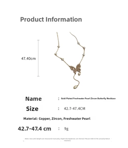 Detail of gold-plated butterfly necklace with zircons and freshwater pearls