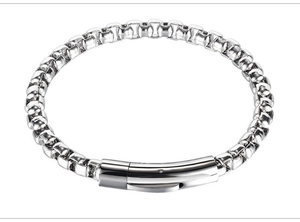 Detailed close-up of a silver box chain bracelet with a polished plug-in buckle clasp
