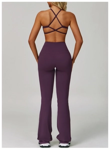 Detail of high-waist flared yoga pants and criss-cross back sports bra in dark purple fabric