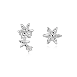 Detail of 925 sterling silver asymmetrical flower stud earrings with clear zircon stones